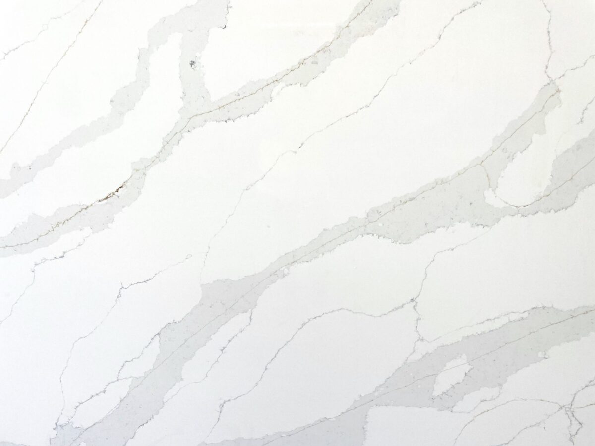 White marble countertop with gray veining pattern.