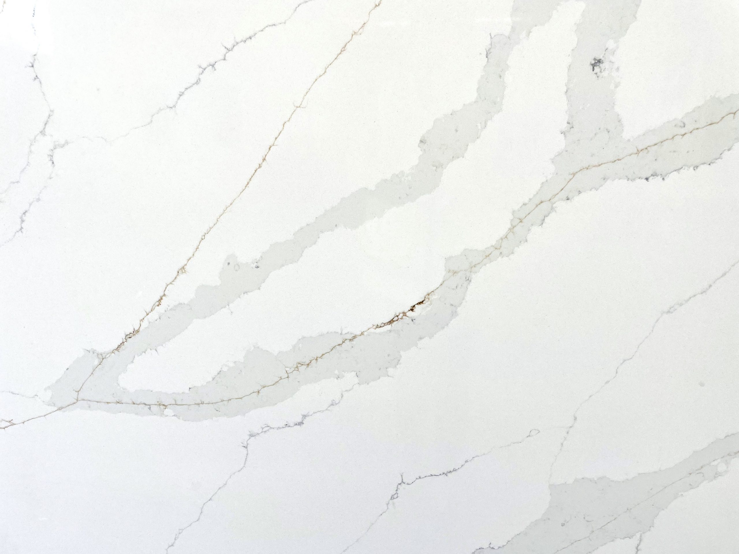 White marble countertop with subtle gray veining.