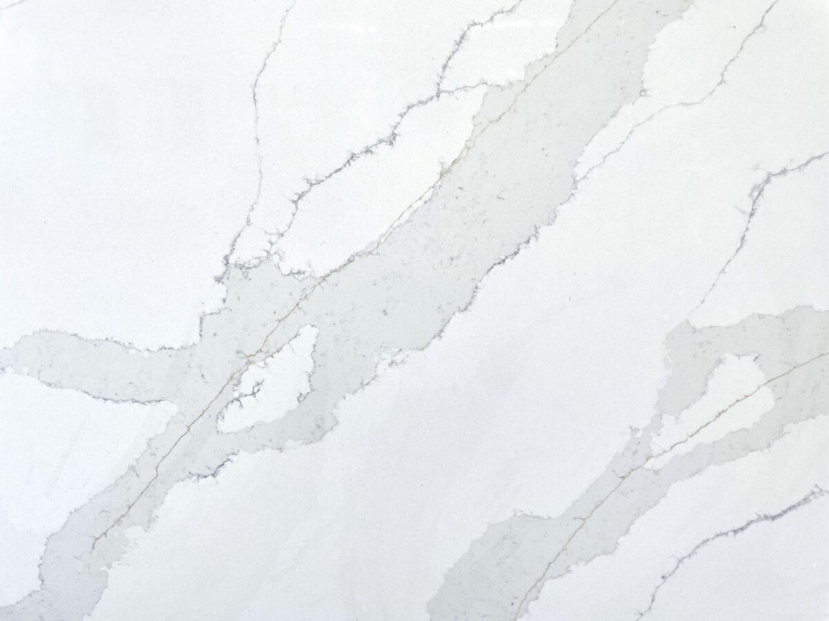 White marble countertop with gray veining pattern.