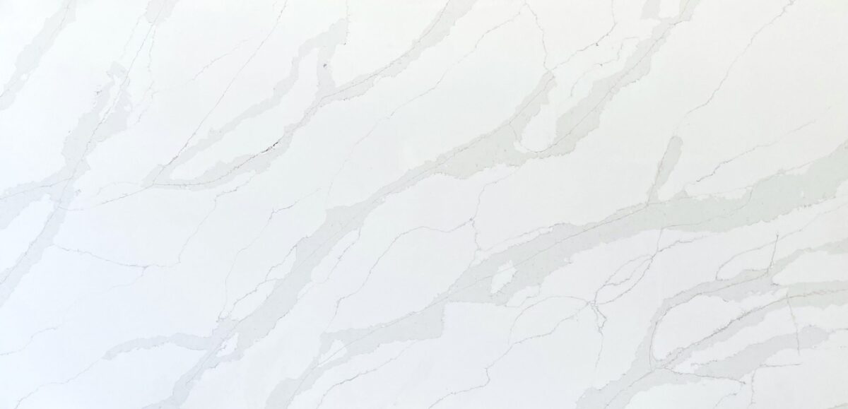 White marble countertop with subtle gray veining pattern.