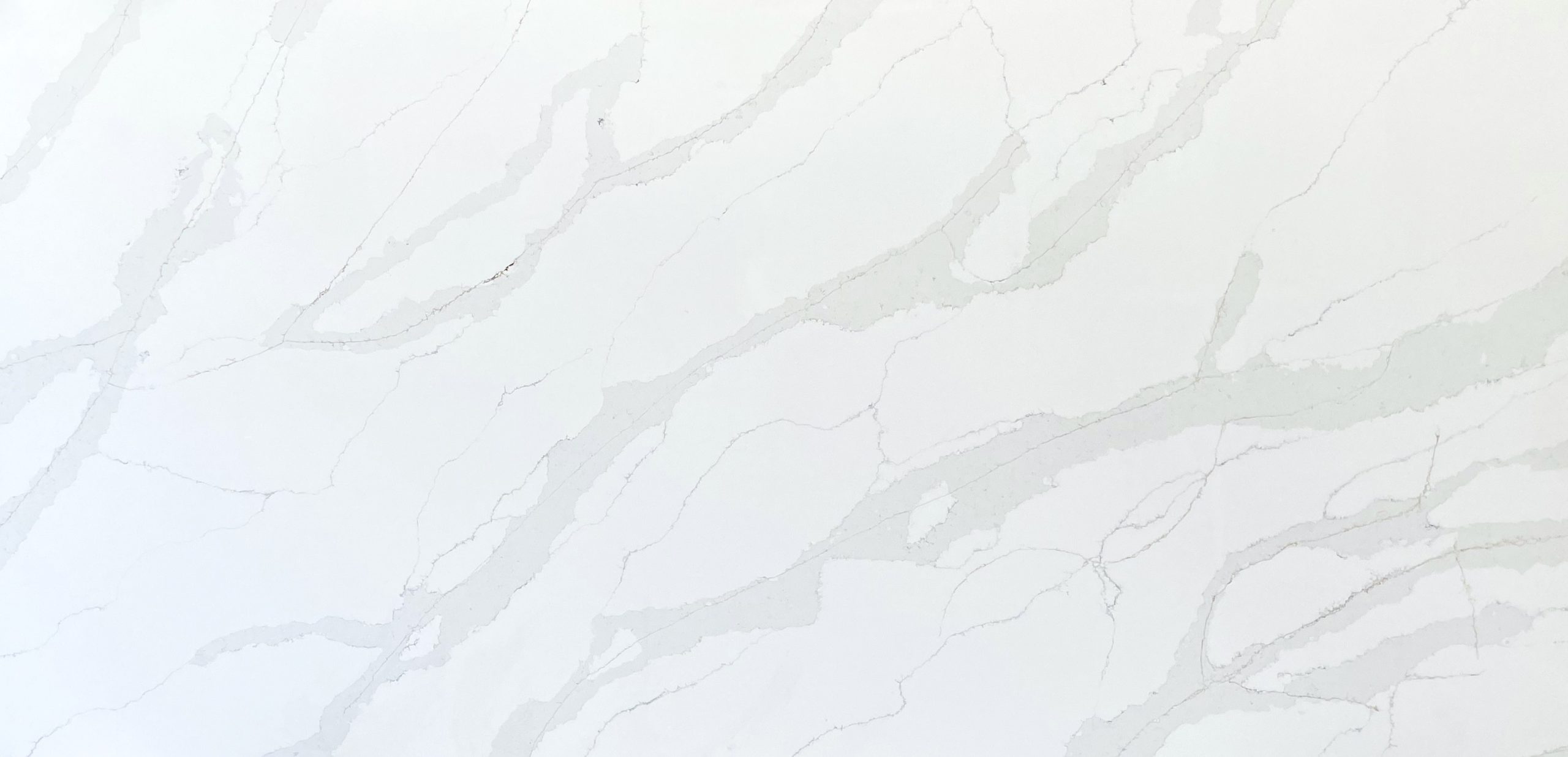 White marble countertop with subtle gray veining pattern.