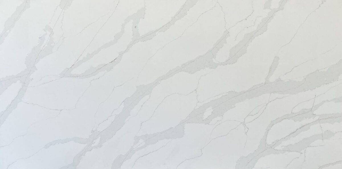 White marble countertop with subtle gray veining pattern.