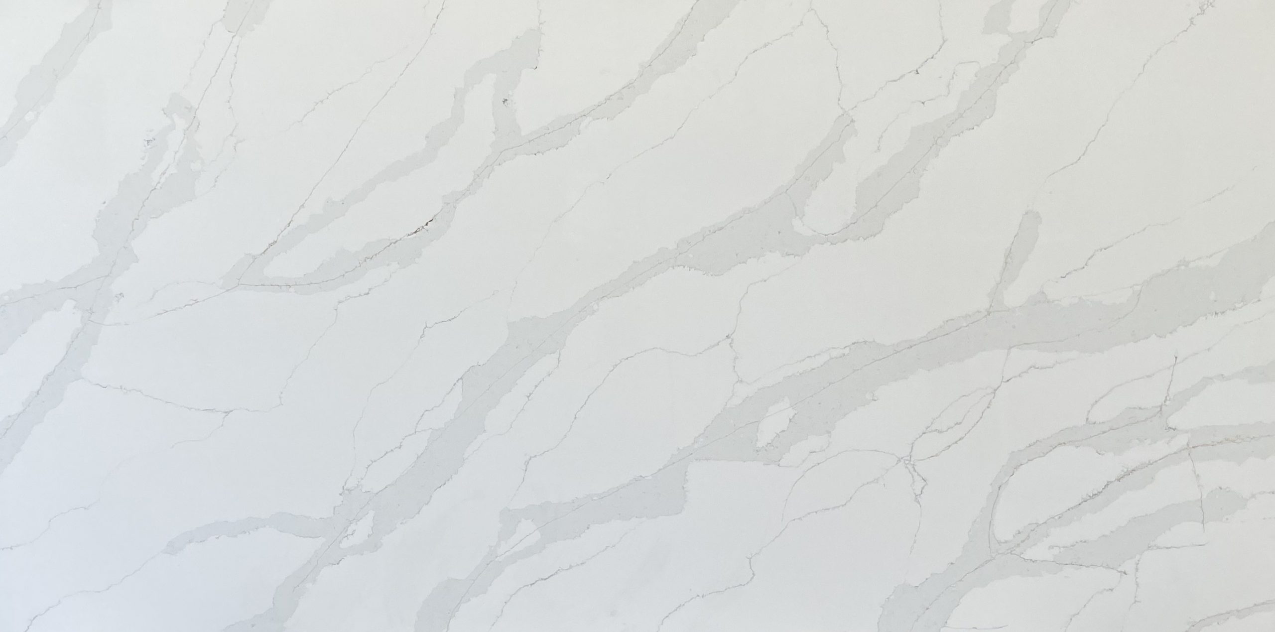 White marble countertop with subtle gray veining pattern.