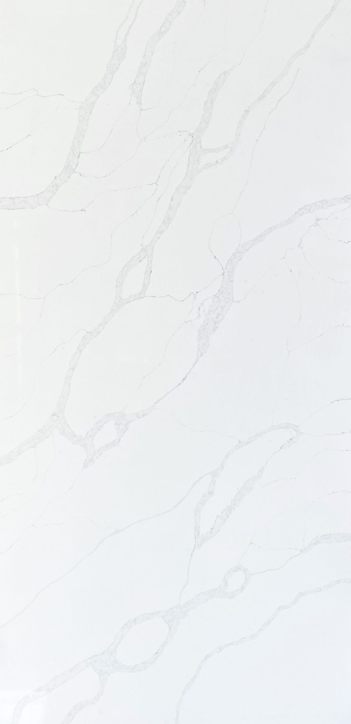 White marble countertop with subtle gray veining pattern.