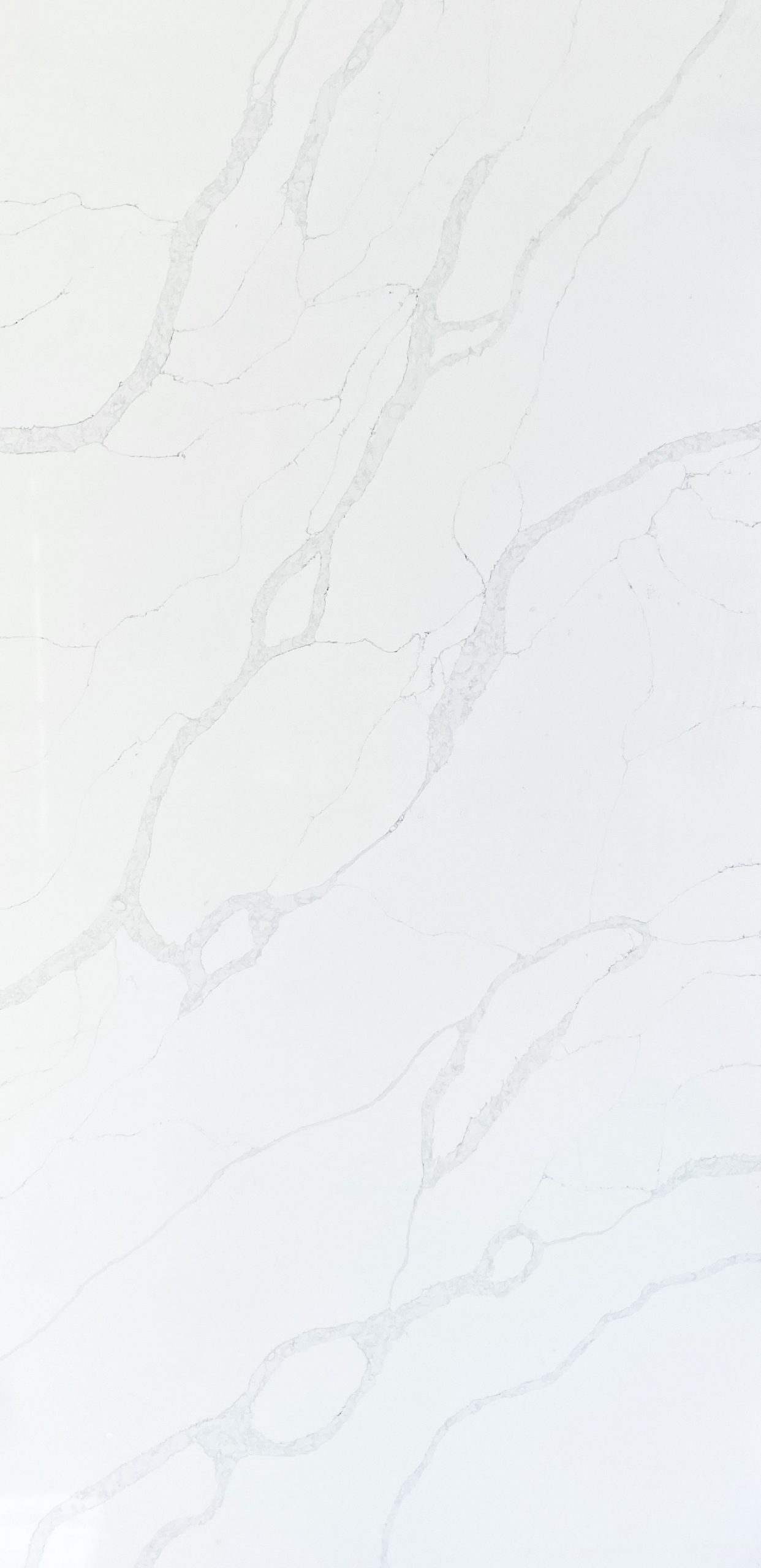 White marble countertop with subtle gray veining pattern.