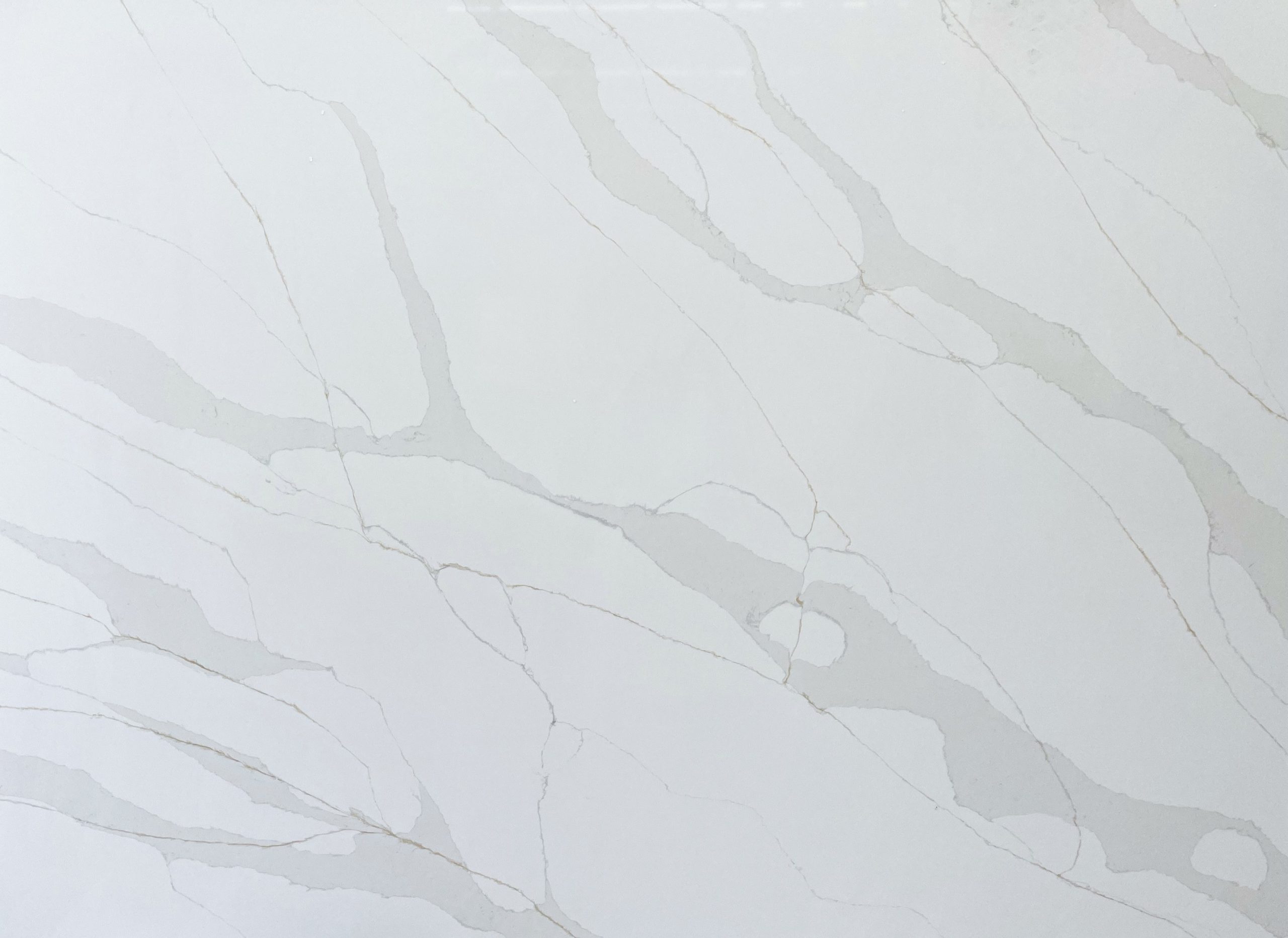 White marble countertop with subtle gray veining.