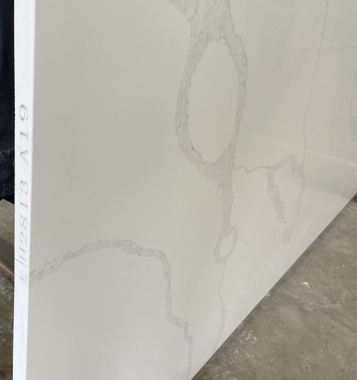 White marble slab with subtle gray veining, labeled H2813 A19.