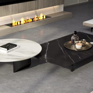 Modern living room with marble coffee tables and fireplace.