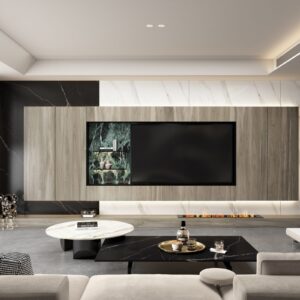 Modern living room with large TV, marble accents, and sleek furniture.