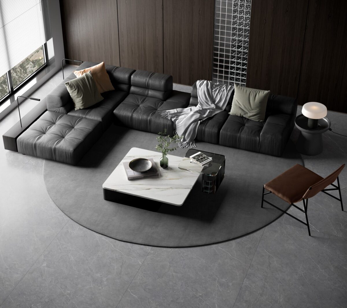 Modern living room with dark sectional sofa and marble coffee table.