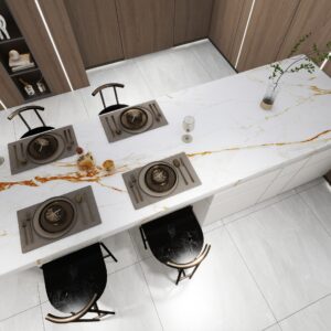 Modern kitchen with marble island, set dining table, and wooden cabinets.