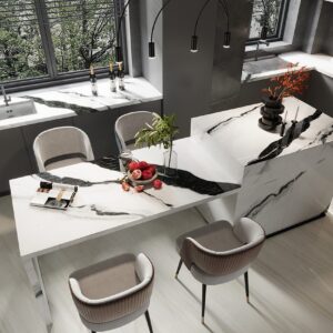 Modern kitchen with marble countertops and stylish bar stools.