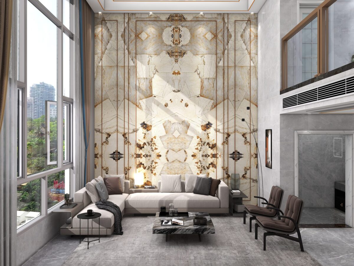 Luxurious living room with marble accent wall and modern furniture.