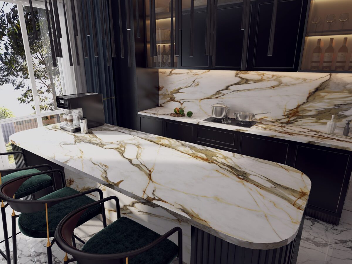 Luxurious kitchen with marble countertop and dark cabinets.