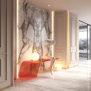 Modern entryway with marble wall, sculpture, and ambient lighting.