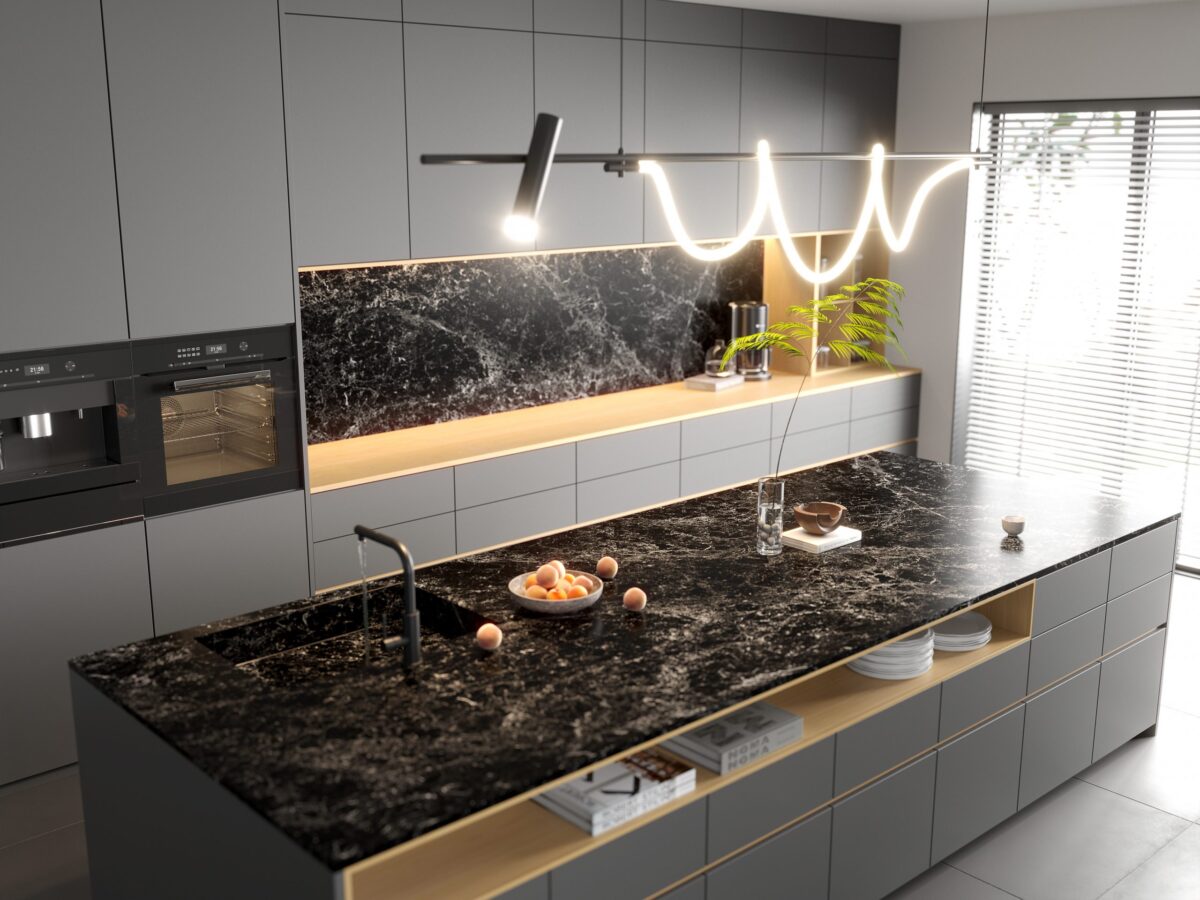Modern kitchen with black marble island and sleek gray cabinets.