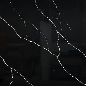 Black marble countertop with white veining pattern.