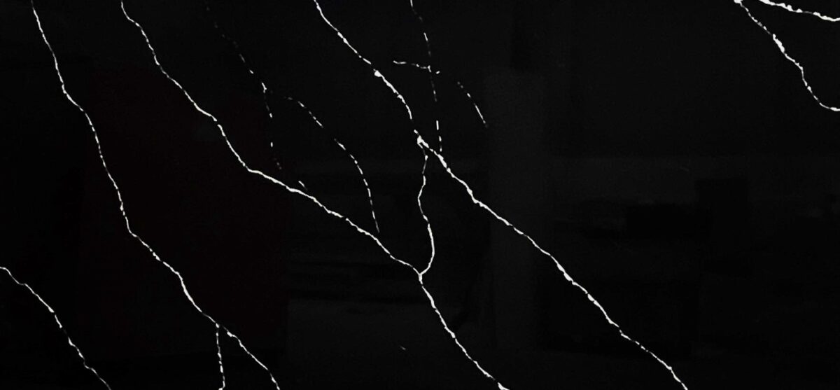 Black marble countertop with white veining pattern.