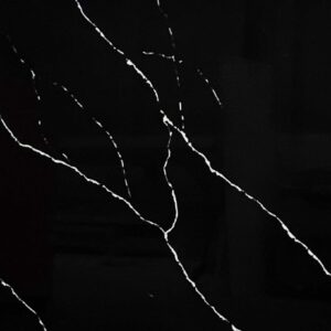 Black marble countertop with white veining pattern.