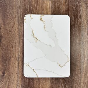 Marble-patterned rectangular plate on wooden surface.