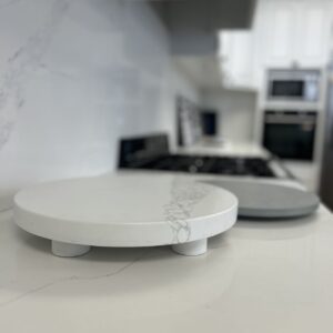 Marble kitchen countertop with round cutting boards in modern kitchen.