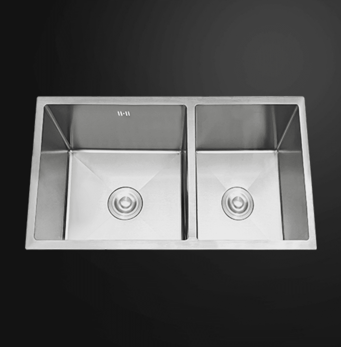 Stainless steel double kitchen sink on a dark background.