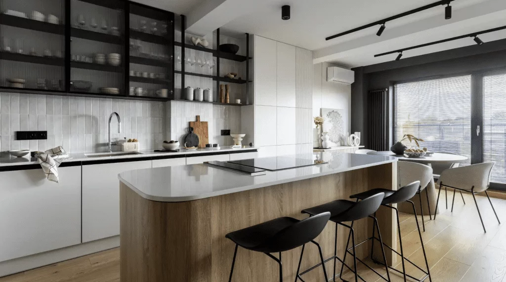 Modern kitchen with wood island, black open shelving, and minimalist white cabinets