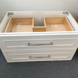 White Eden Shaker wall-hung vanity with two drawers and metal handles.