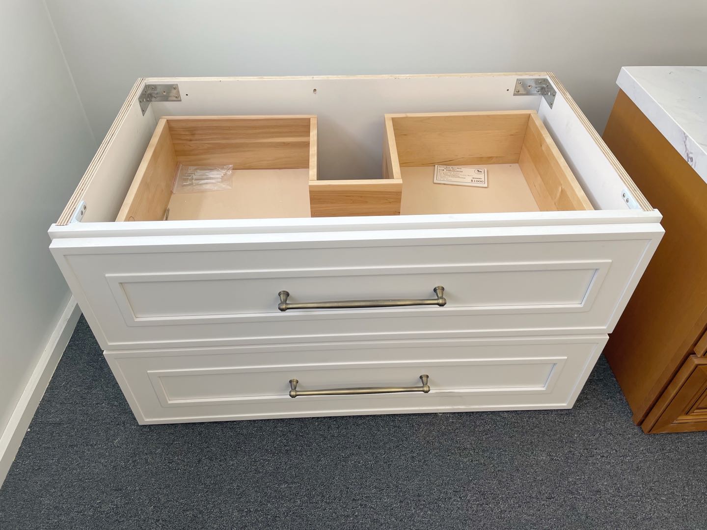 White Eden Shaker wall-hung vanity with two drawers and metal handles.