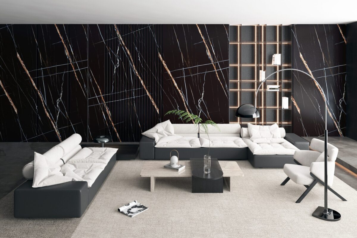 Modern living room with black marble accent wall and contemporary furniture.