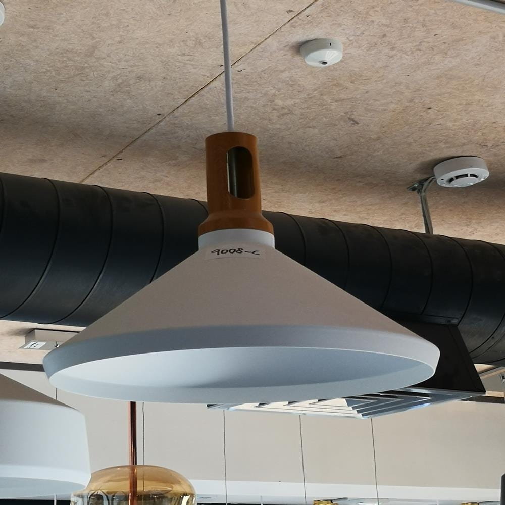 Modern pendant light with wooden accents hanging from ceiling.