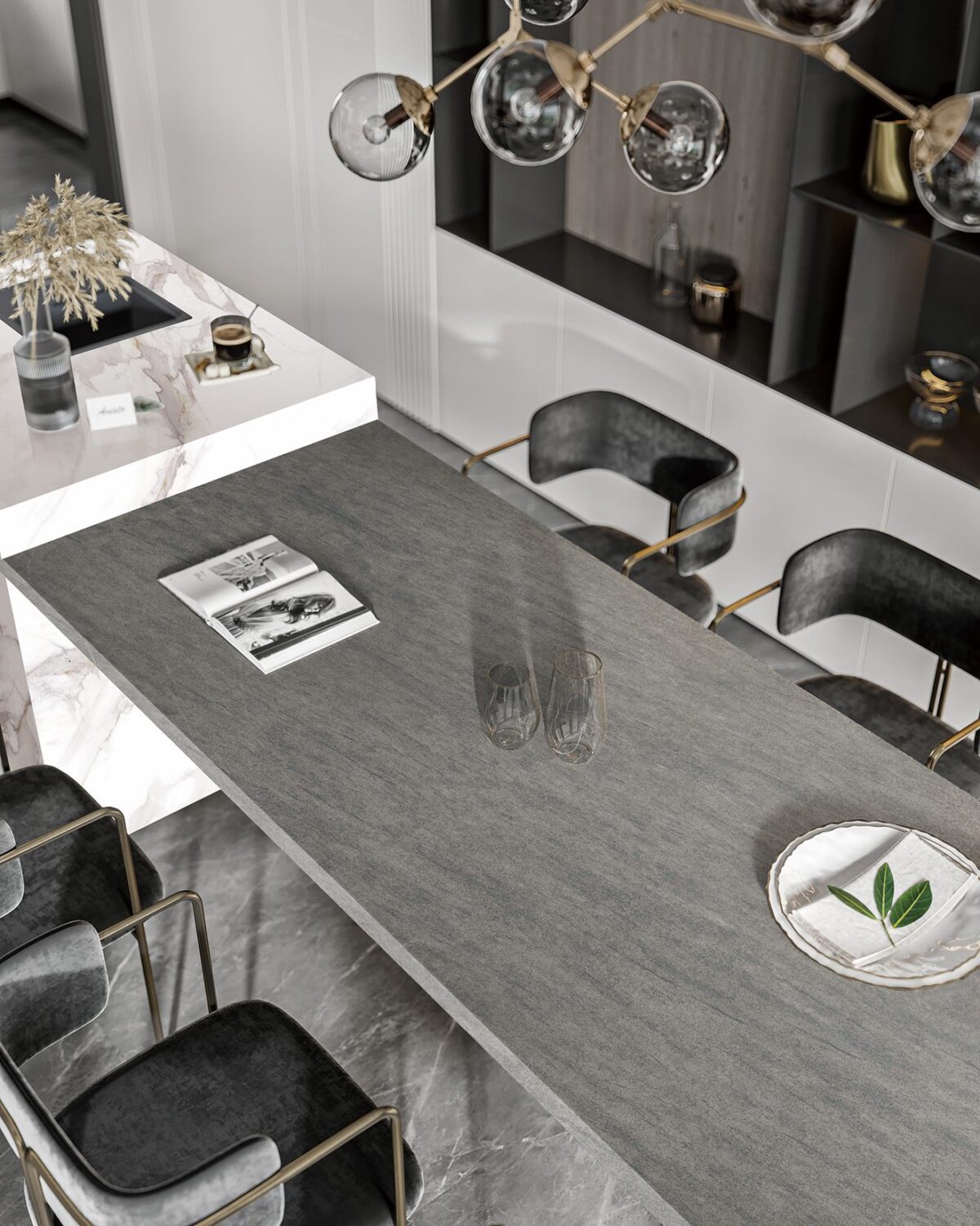 Modern kitchen with marble countertop and black chairs.