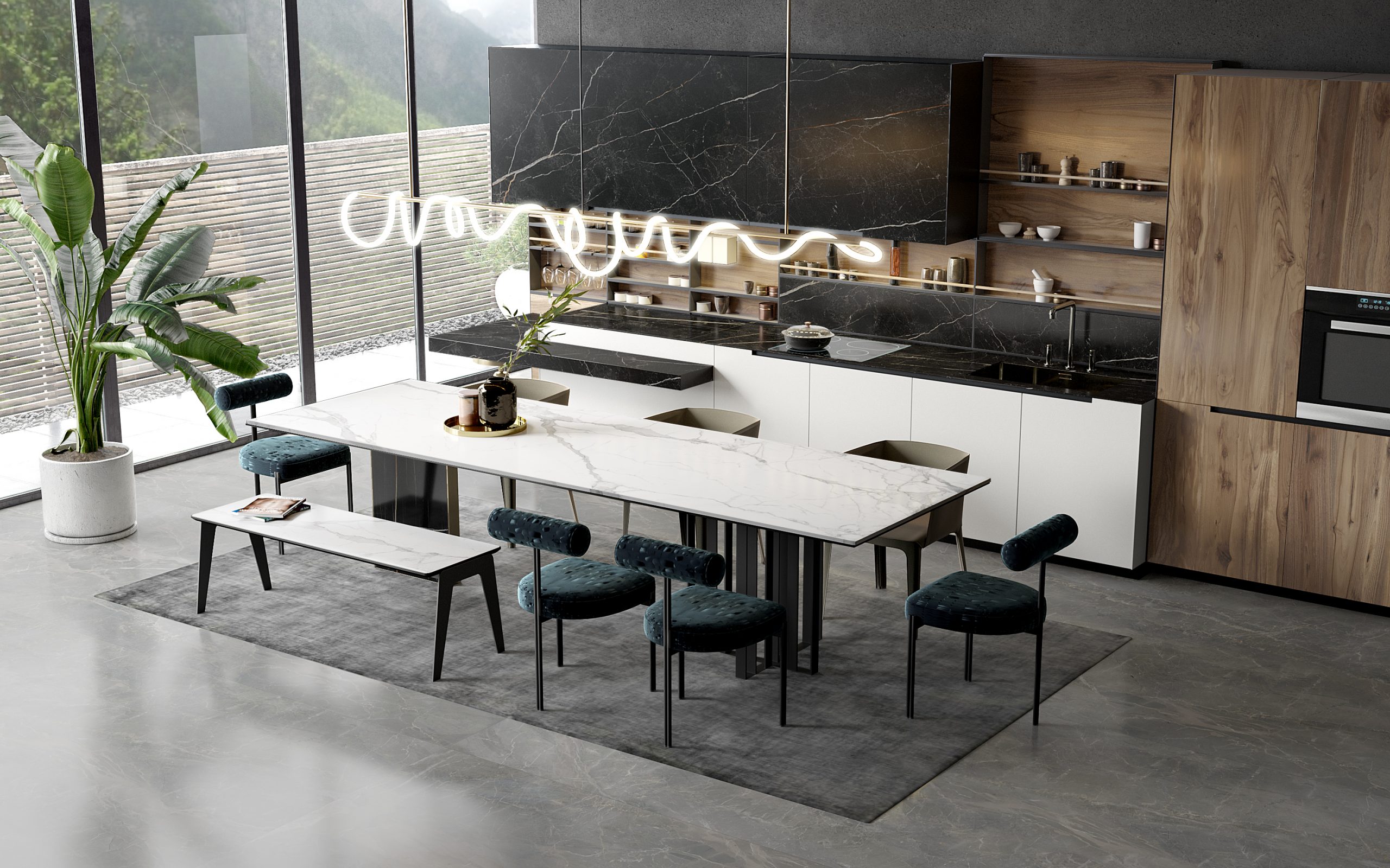 Modern kitchen with marble table, dark cabinets, and large plant.