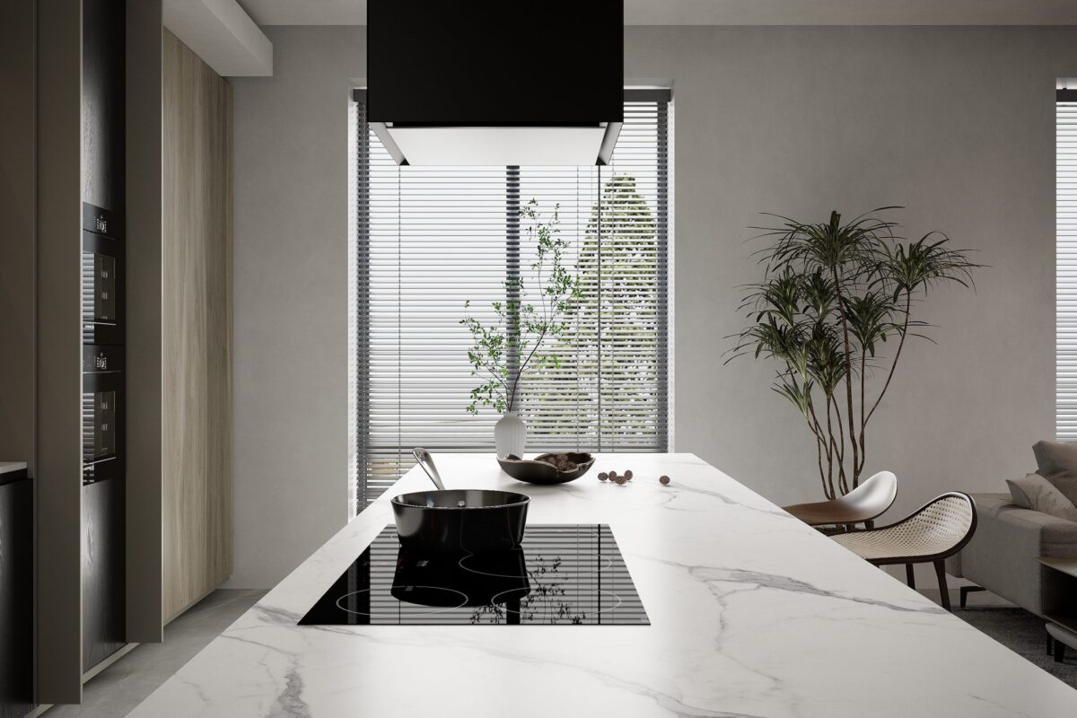 Modern kitchen island with marble countertop and induction cooktop.