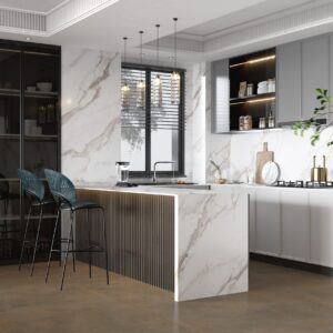 Modern kitchen with marble countertops, bar stools, and elegant lighting.
