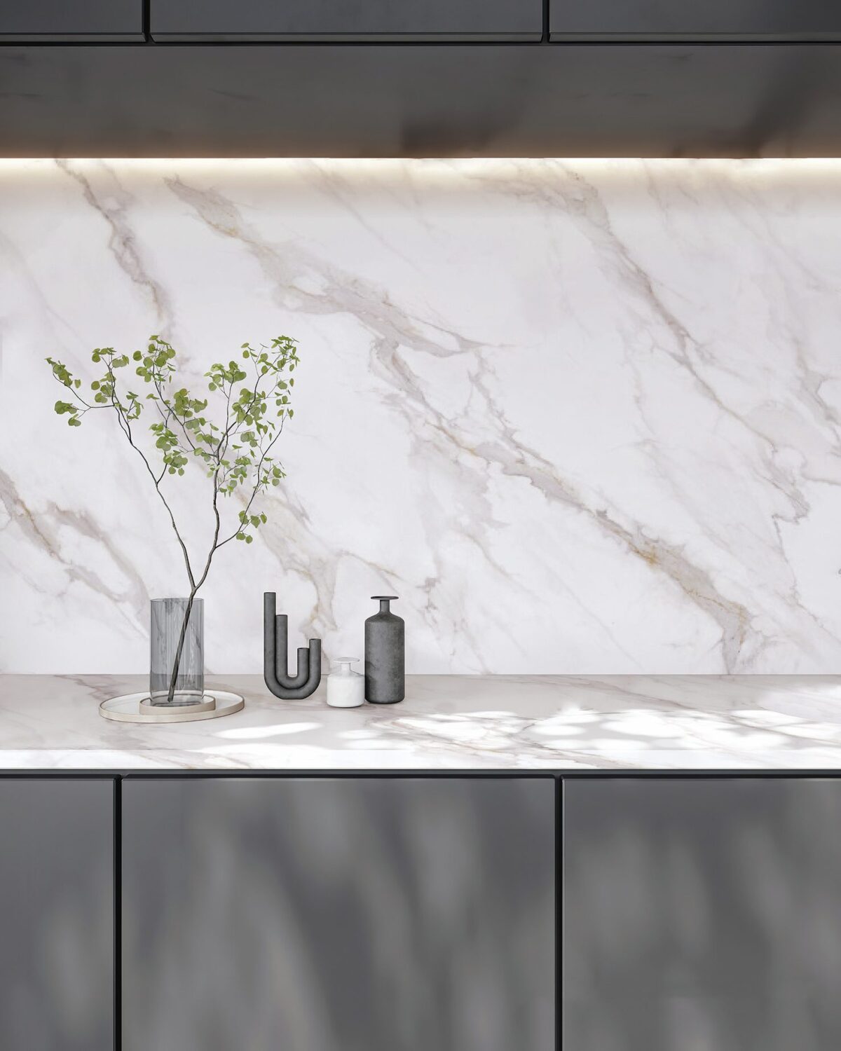 Marble countertop with vase and decorative items.