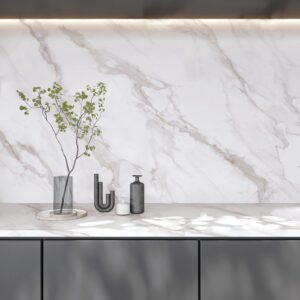 Marble countertop with vase and decorative items.