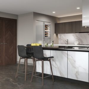 Modern kitchen with marble countertops and bar stools.