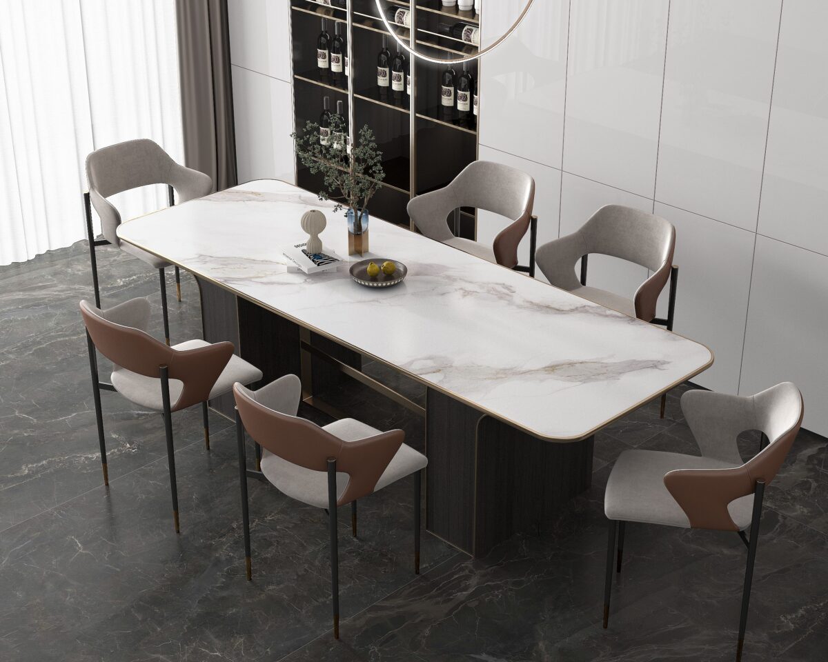 Modern dining room with marble table and six chairs.