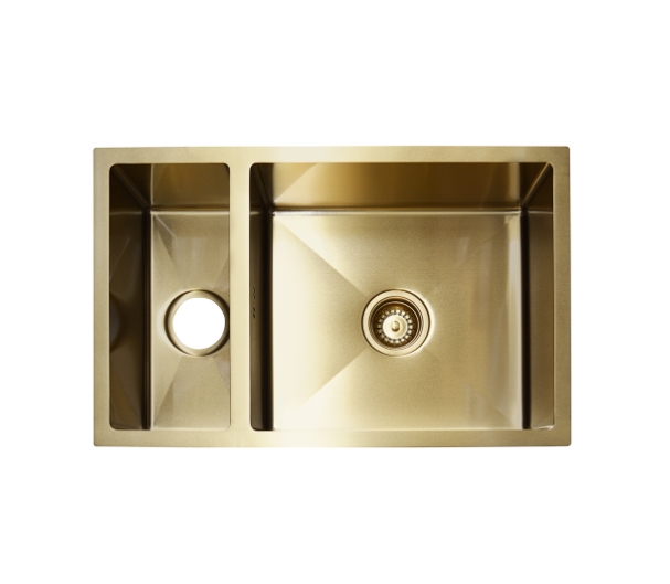 Gold double bowl kitchen sink with drain.